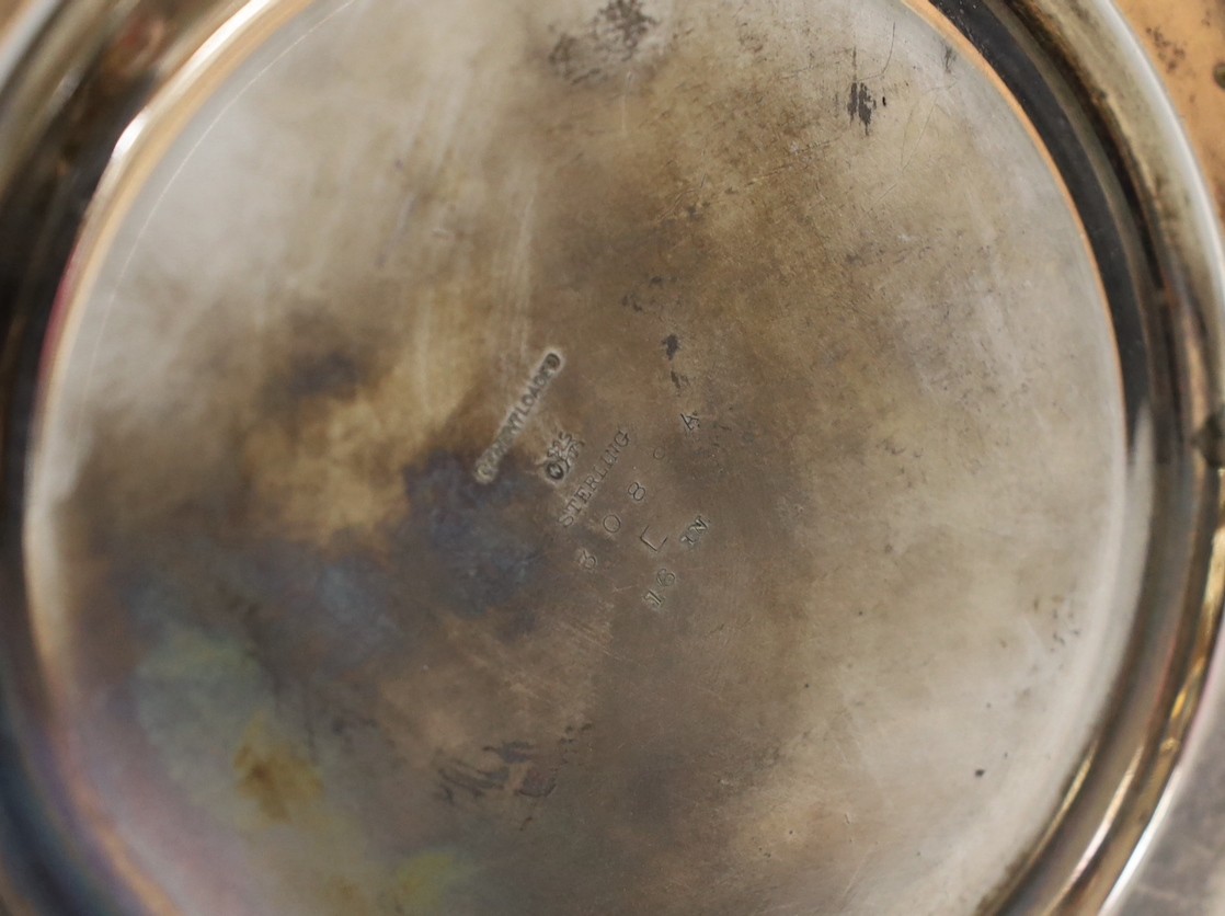 A North American sterling tall vase, with engraved decoration, 40.6cm, weighted.